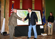 Govenor Brian Schweitzer receiving a copy of the new State Geologic Map from MBMG Director Ed Deal 