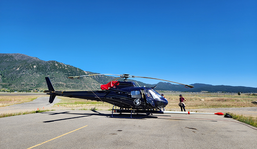 Helicopter used for USGS Earth Mapping Resources Initiative geophysical surveys, equipped with magnetic and radiometric sensors